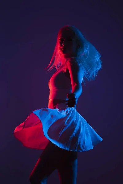 Portrait Young Canadian Woman Sportswear Posing Blue Red Lights Dark — Stock Photo, Image