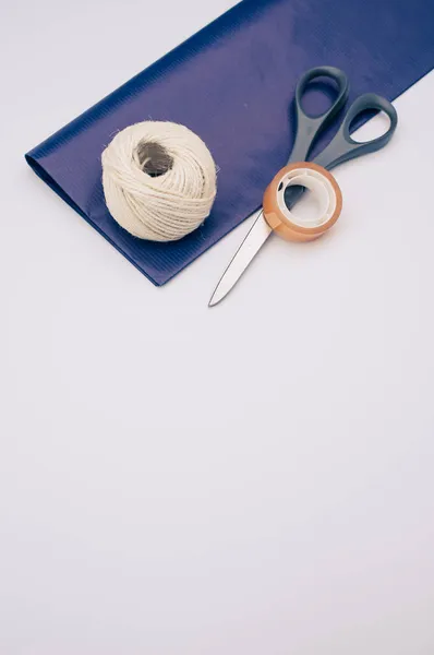 Decorative Yarn Balls Blue Paper Sheet Scissors Tape White Surface — Stock Photo, Image