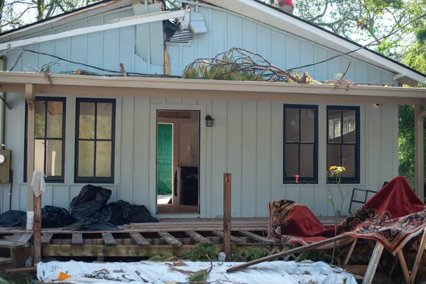 A messy destroyed house after a natural disaster