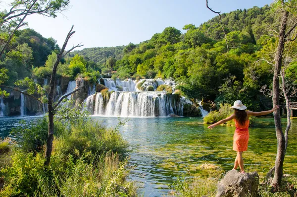 A beautiful scenery of a woman at the famous Krka National Park, Croatia