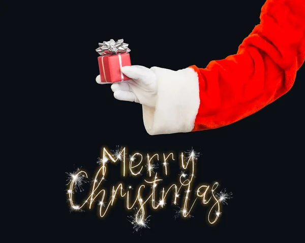 Hand Van Kerstman Met Een Geschenkdoos Met Glanzende Lichten Een — Stockfoto