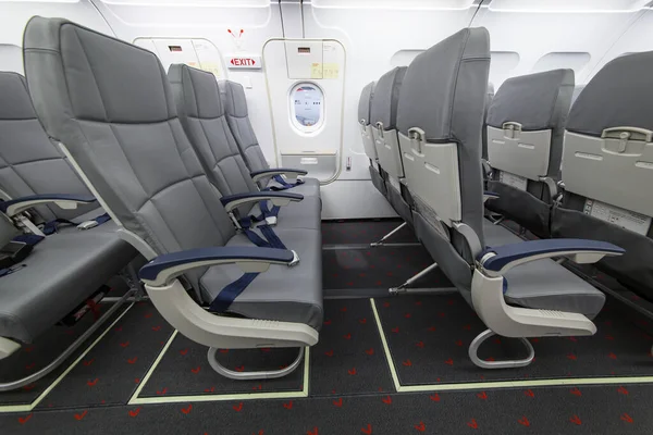 Inside view of emergency exit row in commercial Airbus passenger aircraft