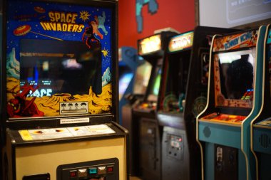 KANSAS CITY, UNITED STATES - Aug 03, 2016: Old school arcade video games; Atari space invaders, Kansas City, United States clipart