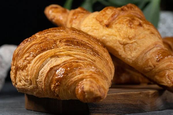 A closeup of french croissants in a bakery