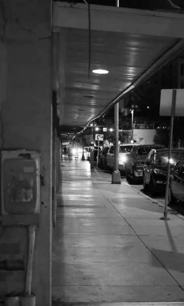 Vertical Grayscale Shot Hallway Cars Parked Building — Stock Photo, Image