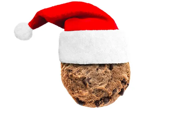 Een Zoet Chocoladekoekje Met Een Kerstmuts Een Witte Achtergrond — Stockfoto