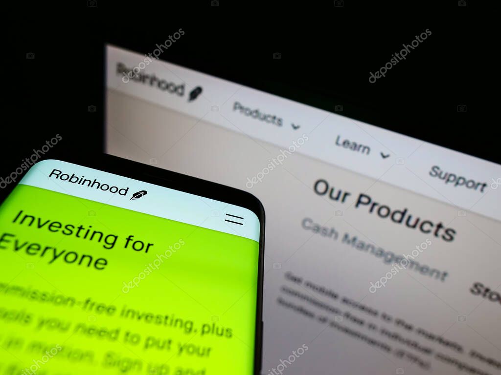 STUTTGART, GERMANY - Feb 01, 2021: Cellphone with business website of US financial services provider Robinhood Markets Inc. on display. Focus on top of phone screen. Unmodified photo.