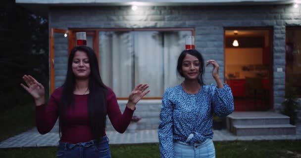 Two Young Women Having Fun Carrying Glasses Wine Heads — Vídeo de stock