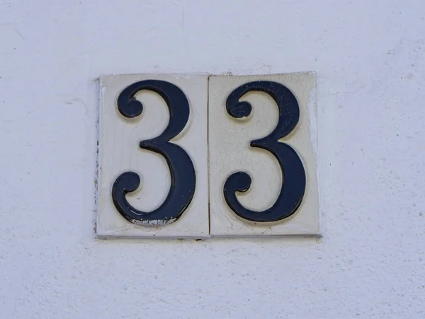 Closeup Shot Number Thirty Three Sign Wall — Stock Photo, Image