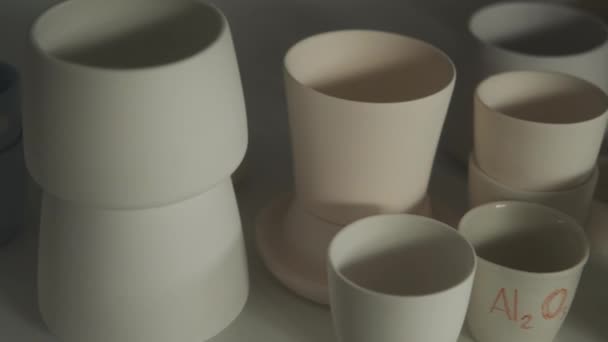 White Ceramic Cups Gray Background — Stock Video