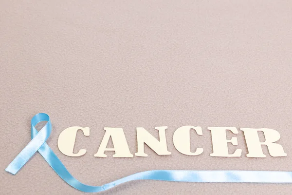 Letras Soletrando Cancro Com Fita Símbolo Câncer Tecido Cor Pastel — Fotografia de Stock