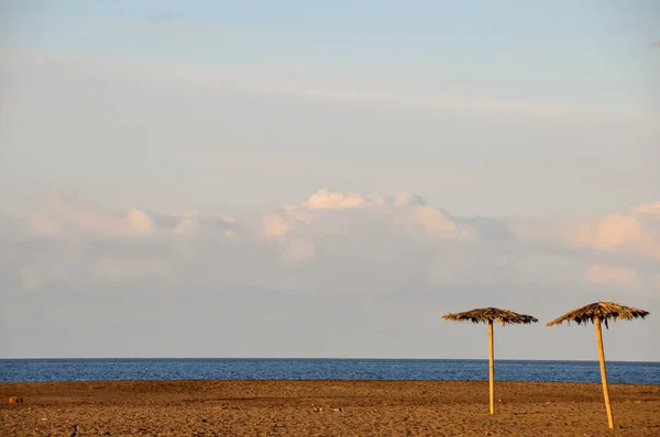 Two Straw Umbrellas Beach Tenerife Spain — стоковое фото