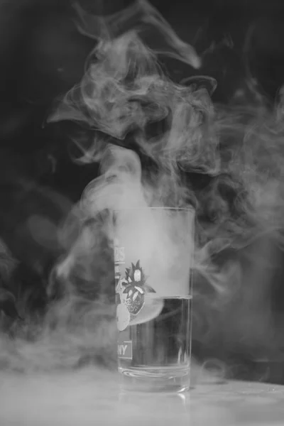 Vertical Grayscale Shot Glass Cold Beverage Smoke Background — Stock Photo, Image