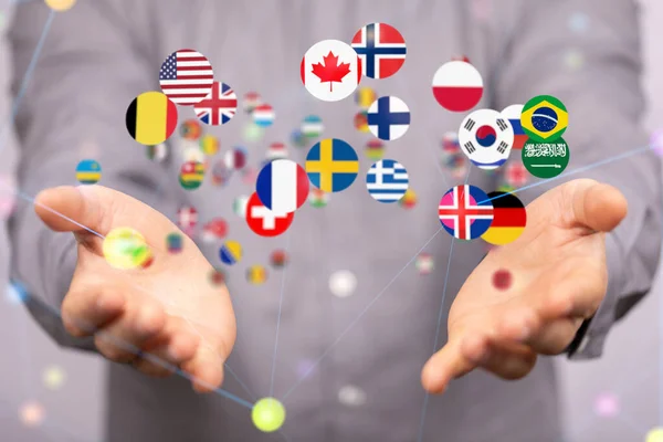 Человеческая Рука Показывающая Цифровую Концепцию Глобальной Коммуникации Плавающие Национальные Флаги — стоковое фото