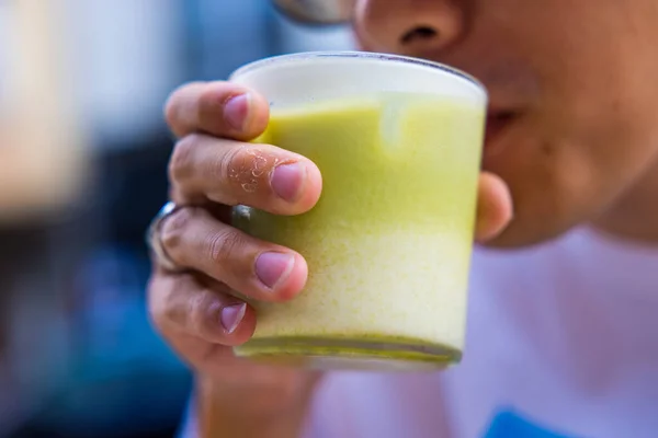 Closeup Shot Person Drinking Iced Matcha Tea — Stock Photo, Image