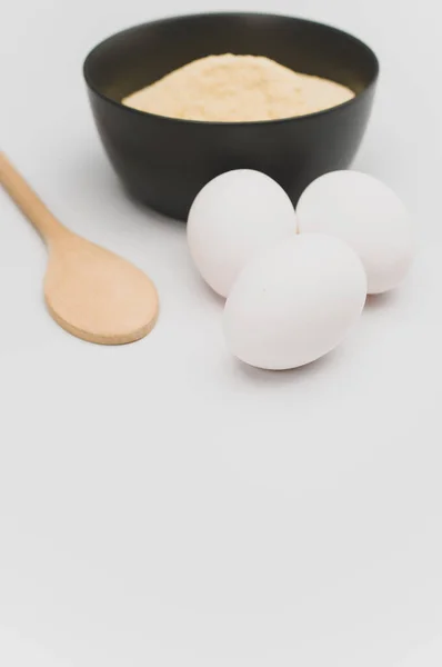 Wooden Spoon White Eggs Dark Gray Bowl Wholegrain Flour White — Stock Photo, Image