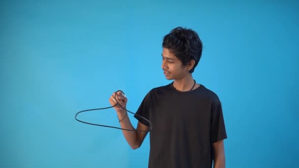 Indian Man Holding Hanger Isolated Blue Background — Stock Video