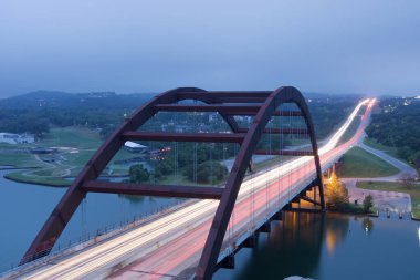 A scenic view of the Pennybacker Bridge in Austin, Texas clipart
