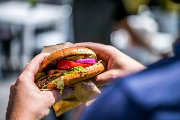 Male Hands Holding Burger Bun — Stock Photo, Image