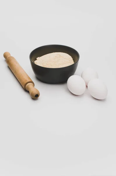 Wooden Rolling Pin White Eggs Dark Gray Bowl Wholegrain Flour — Stock Photo, Image