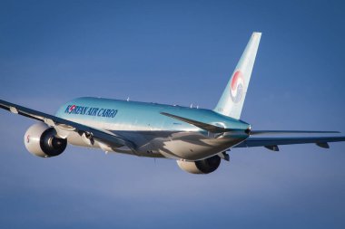 VIENNA, AUSTRIA - Nov 03, 2018: Korean Air Cargo Boeing 777 airplane taking off in Vienna clipart