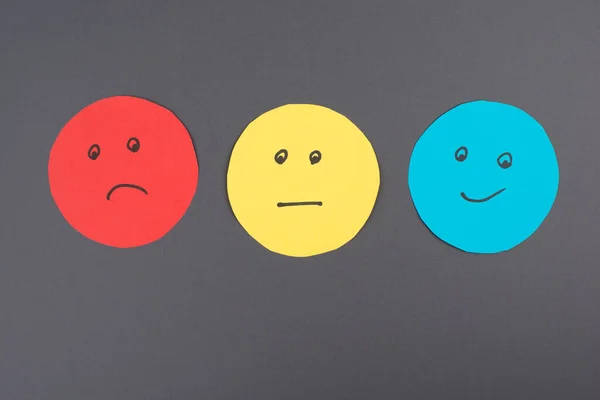 Three Faces Smiling Sad Different Colors Blue Background Copy Space — Stock Photo, Image