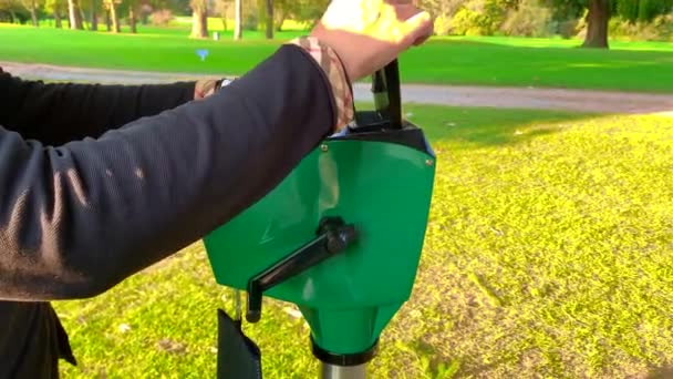 Man Watering Can Green Lawn Mower — Stockvideo