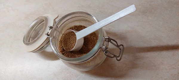 Top View Shot Cinnamon Jar Plastic Spoon — Stockfoto