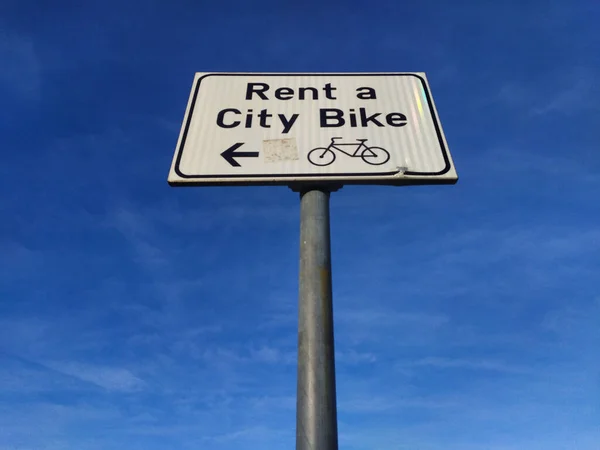 Sign Pole Showing Direction City Bike Rental Area Blue Sky — Stock Photo, Image