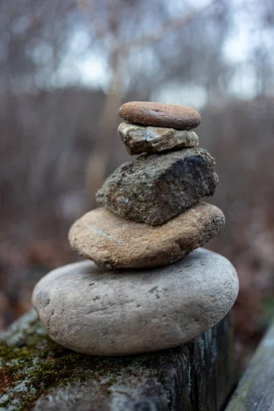 A vertical closeup of stacked rocks outdoors