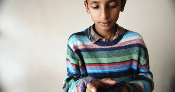 Closeup South Asian Young Boy Colorful Pullover Playing Phone — стоковое фото