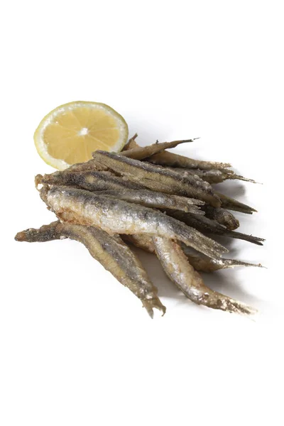 Closeup Fried Anchovies Lemon Slice Isolated White Background — Foto Stock