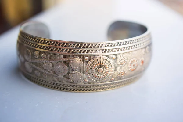 Lose Shot Metal Bracelet White Table Blurry Background — стоковое фото