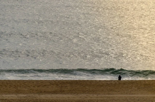 Man Sitting Seashore Fishing Sunset Praia Norte Beach Nazare Portugal — Stock Photo, Image