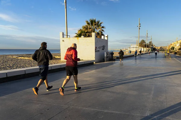 Closeup Shot People Jogging Sea Sunny Day — Stock Photo, Image