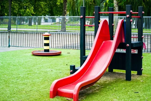 A natural view of red slide on the playground