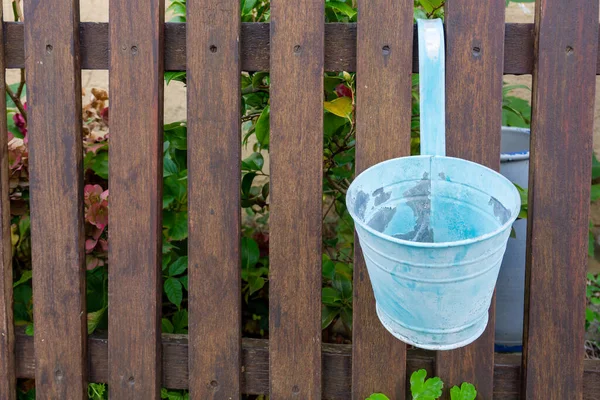 Metallic Bucket Hanging Wooden Fence — Stockfoto