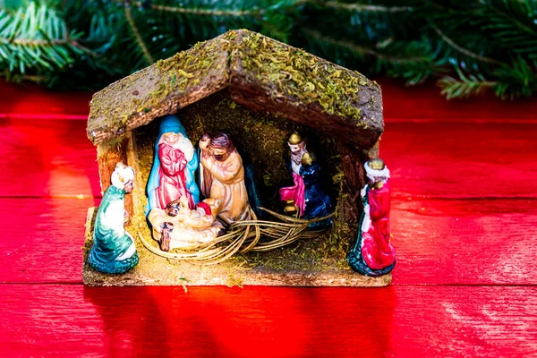 Christmas Backdrop Nativity Scene Red Wooden Background — Fotografia de Stock