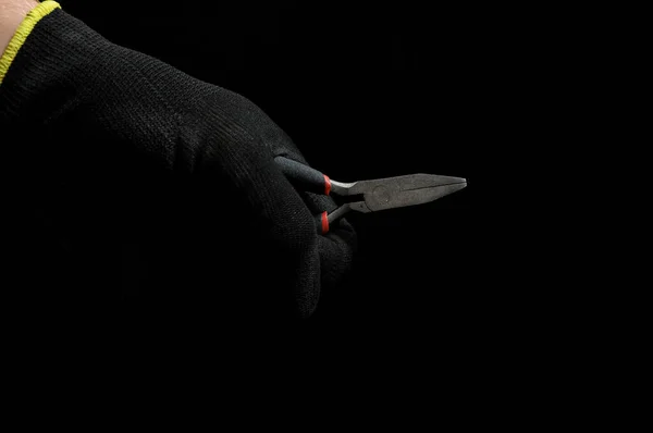 Pliers Hand Glove Isolated Black Background — стоковое фото