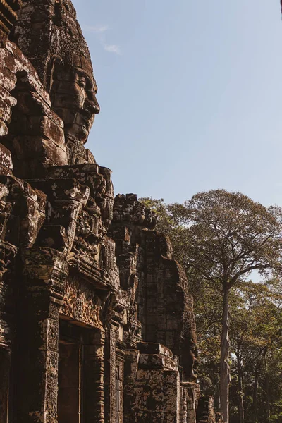 Side View Serene Carved Face Bayon Blue Cloudy Sky Angkor —  Fotos de Stock