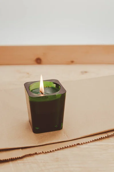 Scented Candle Green Glass Burning Rustic Wooden Tabletop Copy Space — Fotografia de Stock