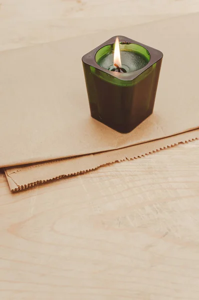 Scented Candle Green Glass Burning Rustic Wooden Tabletop Copy Space — Stock fotografie