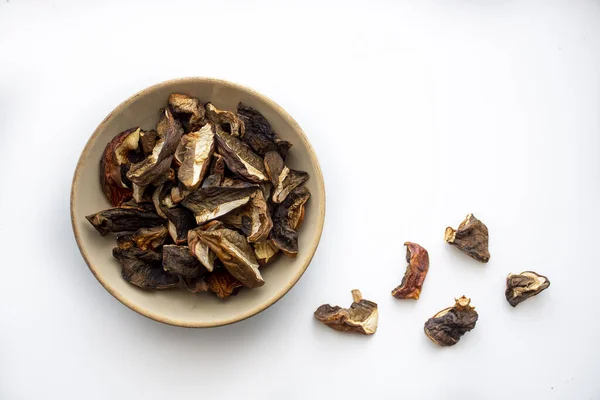 Closeup Shot Sliced Dried Mushrooms Bowl White Surface — Fotografia de Stock