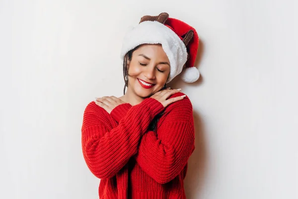 Young Happy Woman Red Sweater Christmas Hat Hugging Herself Self — Foto de Stock