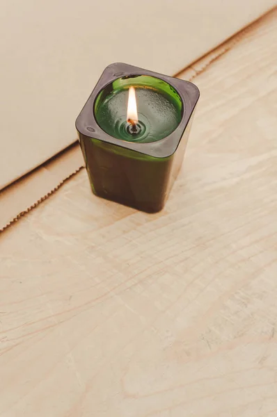 Scented Candle Green Glass Burning Rustic Wooden Tabletop Copy Space — стоковое фото