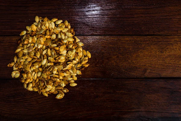 Top View Roasted Salty Pumpkin Seeds Wooden Table — Stock Photo, Image