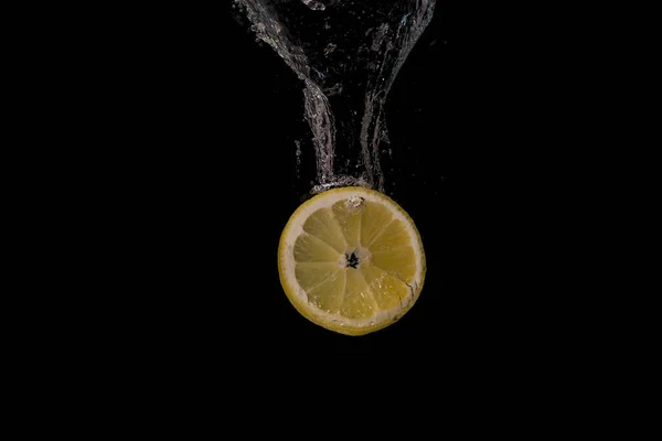 Slice Lemon Water Isolated Black Background — Stock Fotó