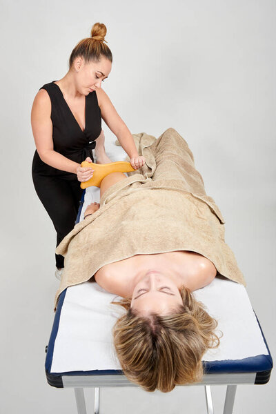 Professional Masseuse Massaging Her Female Client Stock Image