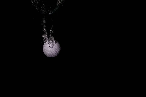 Golf Ball Water Isolated Black Background — Φωτογραφία Αρχείου