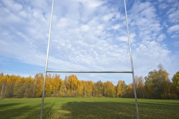 An American football goal post on an empty field